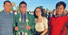 Paul Palma proudly poses with his father, Edelburg Palma (left), his sister Arienne and brother Allen after walking in commencement exercises with fellow Rodriguez High School graduates.